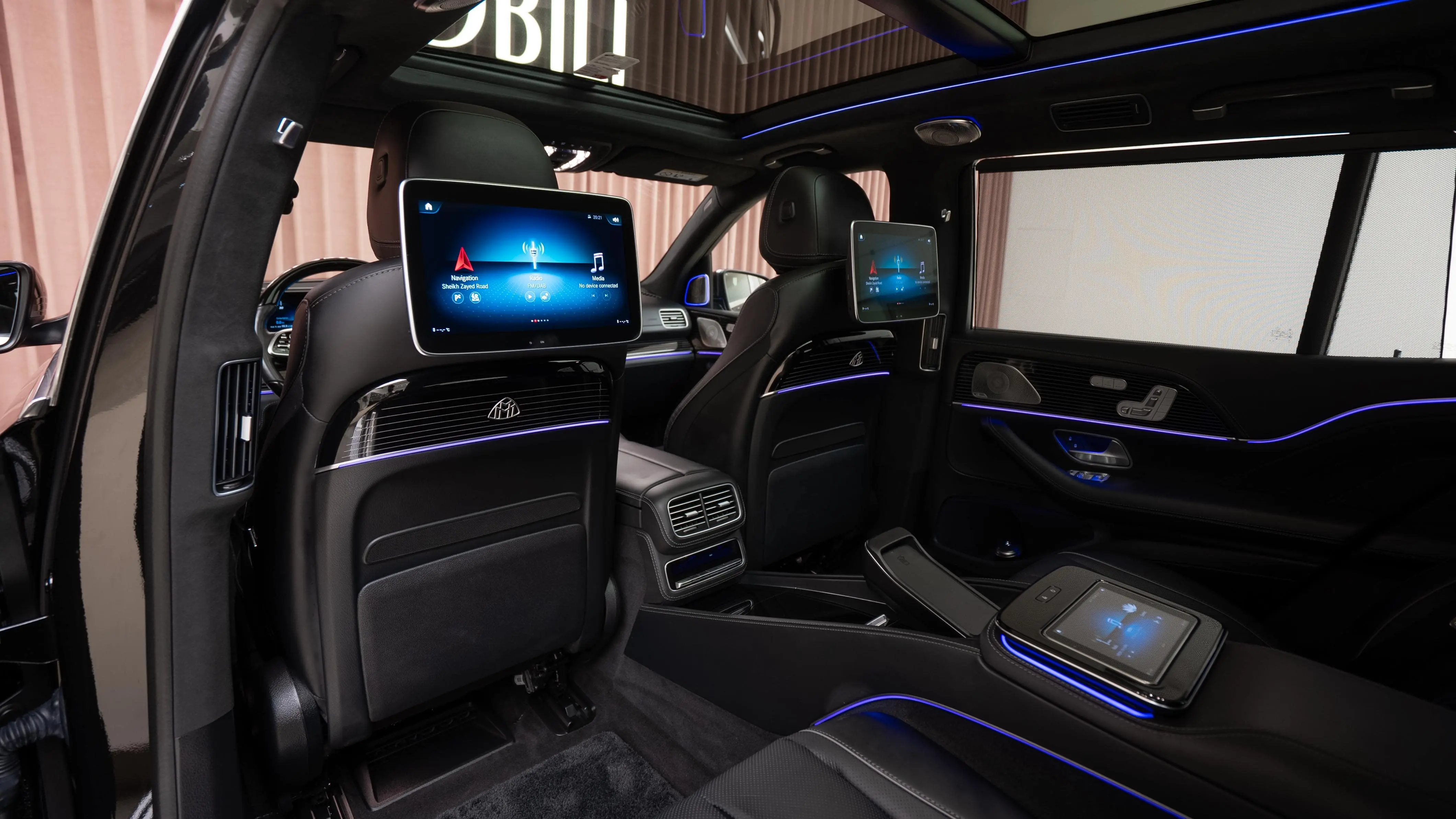Executive entering a private luxury vehicle